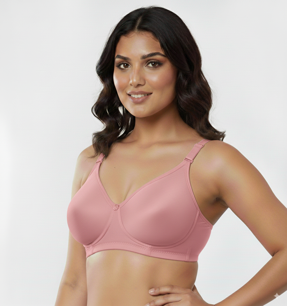 Fanzoh women's seamless cotton bra in soft pink worn by smiling woman with hand on hip